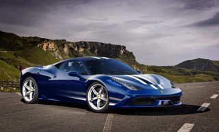 Blue sports car driving mountain 2 - a mountain range in the background free wallpaper