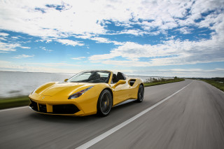 Yellow sports car ocean road - a photo free wallpaper