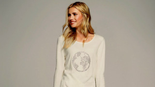 Woman white sweater jeans smiling - international typographic style free wallpaper