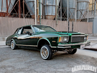 Green car parked building metal - clean free wallpaper