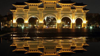 Clock tower night building reflection - a clock tower free wallpaper