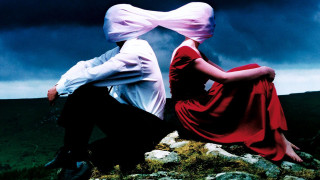 Man woman rock cloudy sky - a surrealist painting free wallpaper