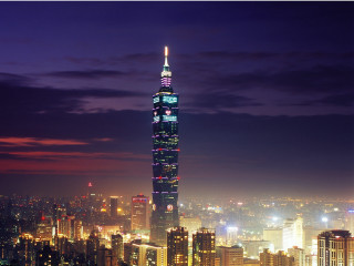 Tall building lights night city - night time in a city free wallpaper