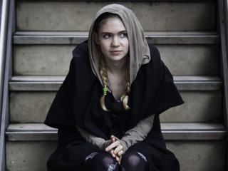Woman sitting stairs black outfit - elinor proby adams free wallpaper