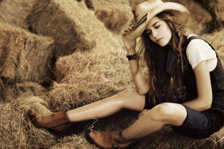 Woman hay hat boots crossed - a pile of hay free wallpaper