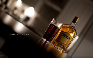 Whiskey bottle wine glass candle - top of a table next free wallpaper