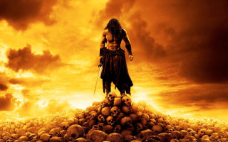 Man standing pile skulls cloudy - dark fantasy art free wallpaper