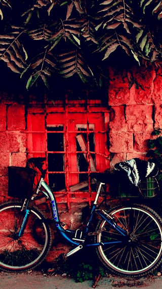 Bike parked red brick building - the side of it free wallpaper