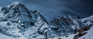 Snowy mountain cloudy sky skier 2 - ski free wallpaper