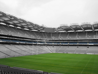 Large empty stadium green field - widescreen free wallpaper