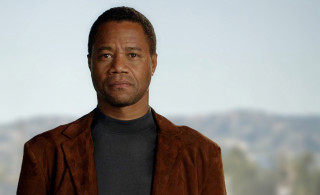 Man brown jacket looking camera - the background in the background free wallpaper