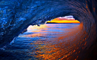 Breaking wave sunset blue orange - the background and the water free wallpaper
