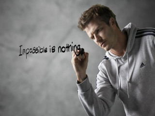 Man holding marker impossible is - black ink free wallpaper