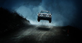 Car jumping dirt road dark - the dark sky free wallpaper