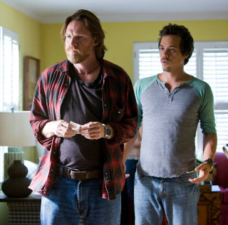 Two men living room holding - dan scott free wallpaper