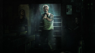 Man holding gun dark room 2 - promotional image free wallpaper for desktop