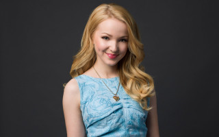 Woman blonde hair blue dress 3 - a black background behind her free wallpaper