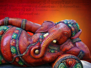 Elephant statue laying red background - figurative art free wallpaper