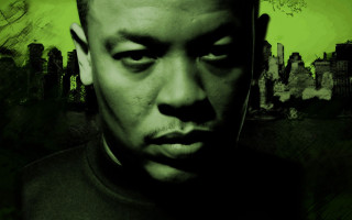 Man black shirt green background 2 - a city skyline in the background free wallpaper