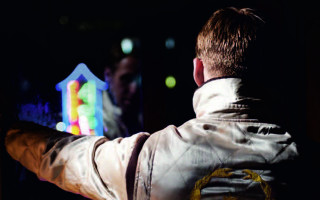Man white jacket playing video - holography free wallpaper