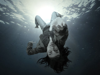 Woman floating water hands up - surreal photography free wallpaper