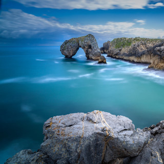 Rocky shore formation ocean sunset - rocky free wallpaper