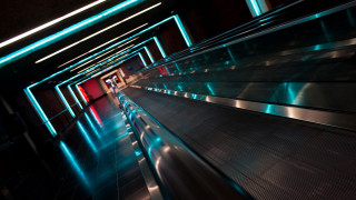 Long escalator red door blue - neon free wallpaper