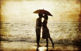 Couple kissing umbrella beach sunset - romantic free wallpaper