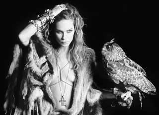 Woman bird arm feathered jacket - her shoulder and a bird free wallpaper