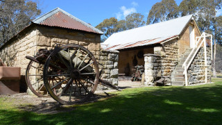 Old stone building wheel sunny - a sunny day free wallpaper