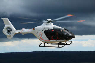 Helicopter flying cloudy sky red - a helicopter free wallpaper