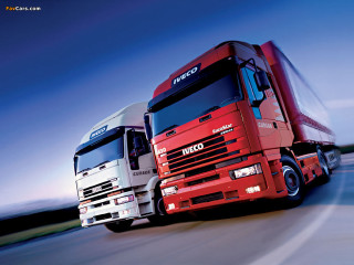 Trucks driving road sunny day - blue sky in the background free wallpaper