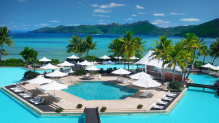 Resort pool umbrellas chairs ocean - umbrella free wallpaper