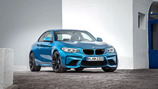 Blue bmw car parked building - a blue bmw car free wallpaper