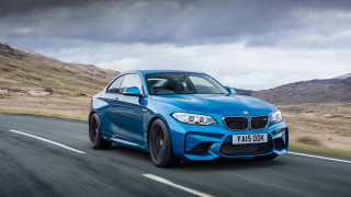 Blue bmw car driving mountains - a blue bmw car free wallpaper