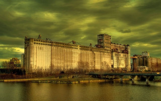 Large building river cloudy sky - a bridge in front free wallpaper