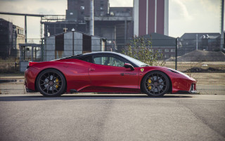 Red sports car fence building - side profile free wallpaper