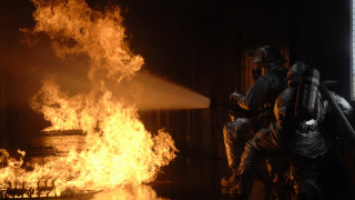 Fireman spraying water building flames - david lachapelle free wallpaper