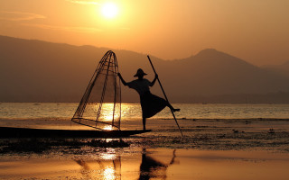 Woman boat pole net sunset - a photo free wallpaper
