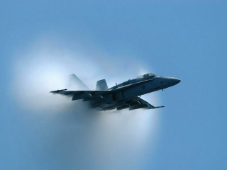 Fighter jet smoke bright light - a blue sky background free wallpaper