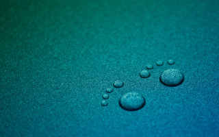 Water droplets blue surface green 2 - a close up of water droplets free wallpaper