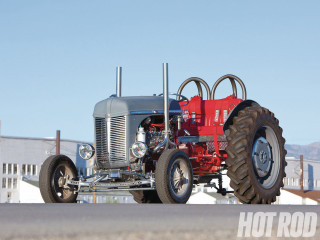Large tractor road building fence - a sky background and a building in the background free wallpaper