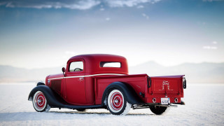Red truck snow field mountain - field next free wallpaper