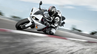 Motorcycle rider track blurry background - a person riding free wallpaper