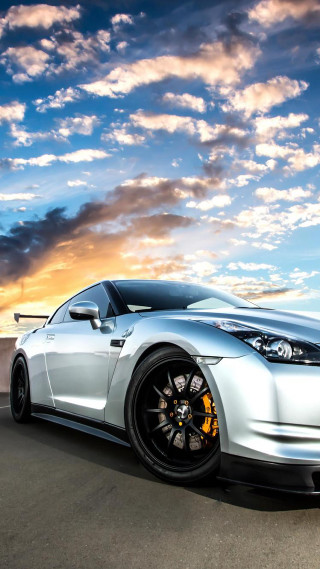 Silver sports car cloudy sky 10 - dawn free wallpaper