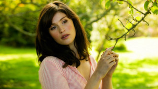 Woman pink shirt holding branch 2 - a branch free wallpaper