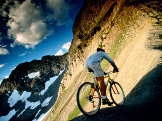 Mountain biking sky clouds landscape - a man riding free wallpaper