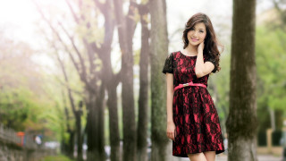 Woman red dress park trees 2 - a park free wallpaper