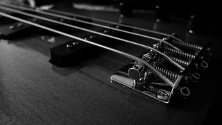 Guitar closeup blackbackground person holding - a close up of a guitar free wallpaper