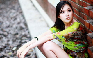 Woman brick wall crossed posing - a woman leaning against a brick wall free wallpaper